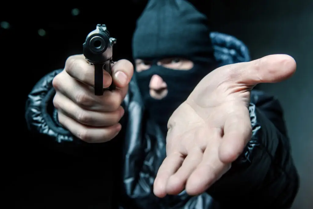 Robber with gun