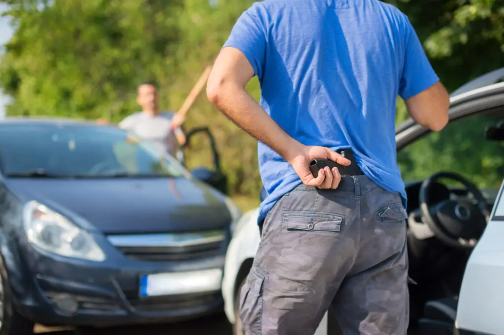 aggressive drivers attacked each other with weapons in traffic